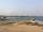 ساحل قوسی شکل و زیبای المینا رو در سمت چپ میبینید