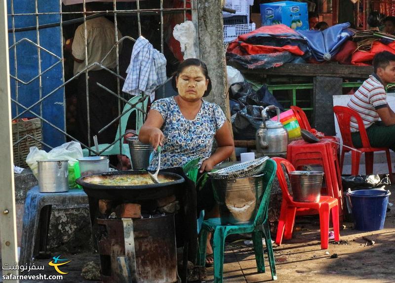 خانم فروشنده میانماری با ماسک تاناکا